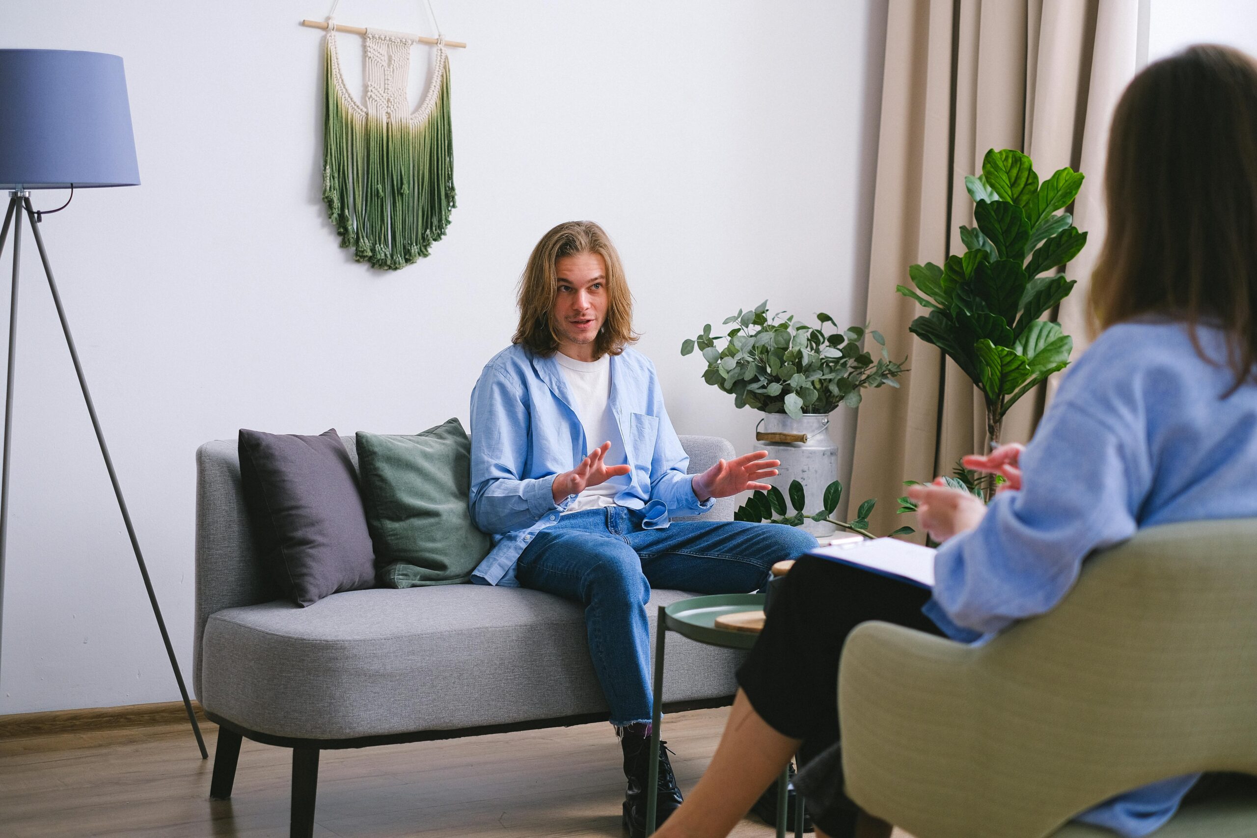 Male adolescent sitting in individual therapy session